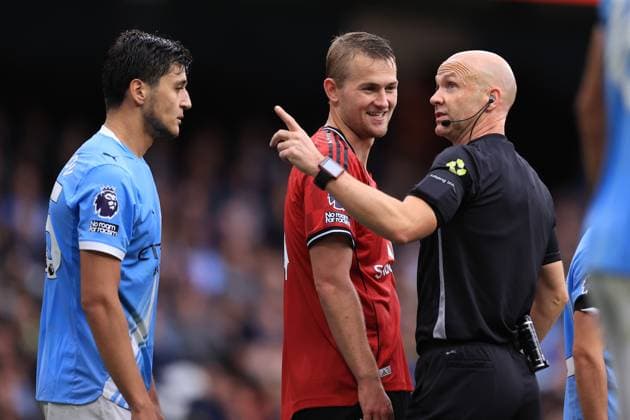 Manchester City v Manchester United, ManU 14th September 2025 - Premier League - Manchester City v Manchester United - Abdukodir Khusanov of Manchester City, Matthijs de Ligt of Manchester United and referee Anthony Taylor - Photo: Simon Stacpoole Offside. Manchester UK Copyright: xSimonxStacpoolexOffside