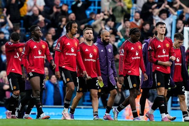 Manchester, England, 14th September 2025. Dejected Manchester United, ManU players leave the pitch after the Manchester City vs Manchester United Premier League match at the Etihad Stadium, Manchester. Picture credit should read: Andrew Yates Sportimage EDITORIAL USE ONLY. No use with unauthorised audio, video, data, fixture lists, club league logos or live services. Online in-match use limited to 120 images, no video emulation. No use in betting, games or single club league player publications. SPI_080_AY_MCI_MUFC SPI-4139-0080