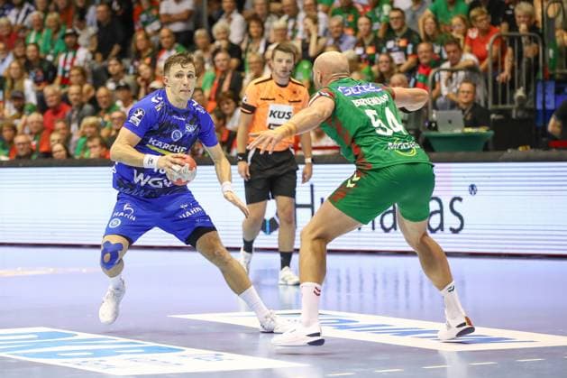 14.09.2025, xgox, Handball - Daikin HBL SC Magdeburg - TVB Stuttgart emspor, v.l. Simone Mengon (Stuttgart, 15) am Ball, plays the ball Magdeburg