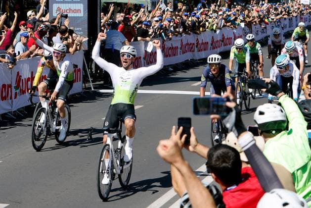 (250915) -- ROMANIA, Sept. 15, 2025 -- Radoslaw Fratczak (C) of Poland celebrates winning the last stage of Tour of Romania 2025 cycling race in Bucharest, Romania, Sept. 14, 2025. (Photo by Xinhua) (SP)ROMANIA-BUCHAREST-CYCLING TOUR OF ROMANIA CristianxCristel 