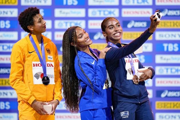 Athletics: World championships in Tokyo Bronze medalist Natalia Linares (R) of Colombia takes a selfie with gold medalist Tara Davis-Woodhall (C) of the United States and silver medalist Malaika Mihambo of Germany during a medal ceremony for the women s long jump event at the World Athletics Championships at the National Stadium in Tokyo on Sept. 15, 2025.  A14AA0004851329P