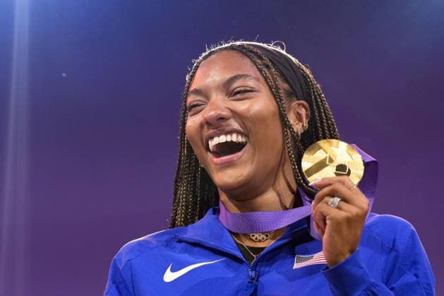 Athletics: World championships in Tokyo Gold medalist Tara Davis-Woodhall of the United States poses with her medal during a medal ceremony for the women s long jump event at the World Athletics Championships at the National Stadium in Tokyo on Sept. 15, 2025.  A14AA0004851331P