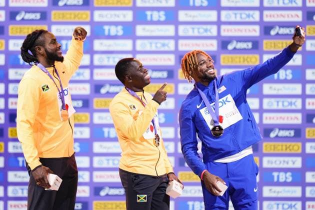 Athletics: World championships in Tokyo Noah Lyles (R) of the United States takes a selfie with gold medalist Oblique Seville (C) and silver medalist Kishane Thompson of Jamaica during the medal ceremony for the men s 100-meter event at the World Athletics Championships at the National Stadium in Tokyo on Sept. 15, 2025.  A14AA0004851369P
