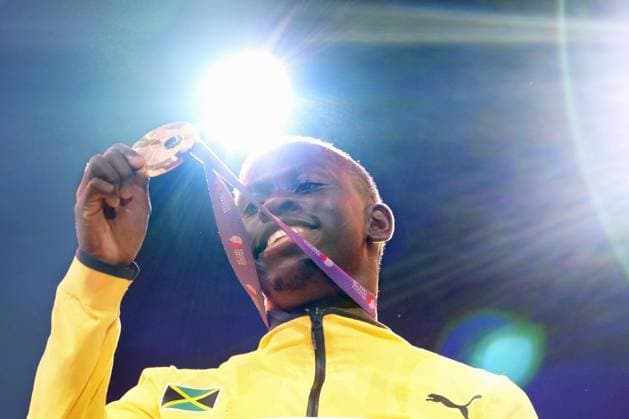Athletics: World championships in Tokyo Gold medalist Oblique Seville of Jamaica poses on the podium during the medal ceremony for the men s 100-meter event at the World Athletics Championships at the National Stadium in Tokyo on Sept. 15, 2025.  A14AA0004851378P