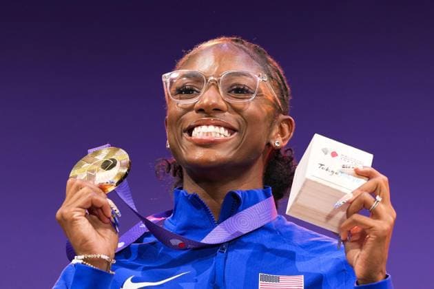 Athletics: World championships in Tokyo Gold medalist Melissa Jefferson-Wooden of the United States poses on the podium during the medal ceremony for the women s 100-meter event at the World Athletics Championships at the National Stadium in Tokyo on Sept. 15, 2025.  A14AA0004851385P