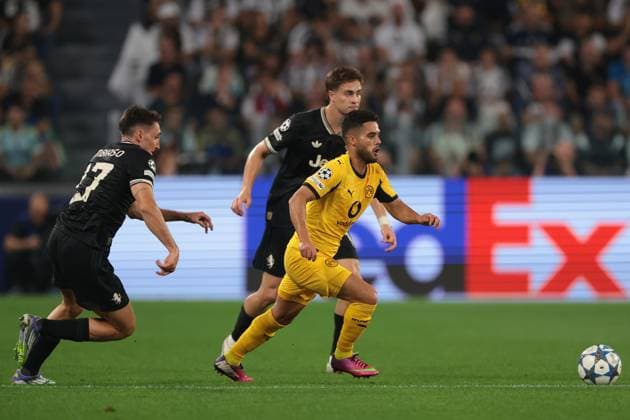Turin, Italy, 16th September 2025. Yan Couto of Borussia Dortmund is pursued by Andrea Cambiaso and Kenan Yildiz of Juventus during the Juventus vs Borussia Dortmund UEFA Champions League match at Allianz Stadium, Turin. Picture credit should read: Jonathan Moscrop Sportimage EDITORIAL USE ONLY. No use with unauthorised audio, video, data, fixture lists, club league logos or live services. Online in-match use limited to 120 images, no video emulation. No use in betting, games or single club league player publications. SPI_005_JM_JUVE_BORUSSIA_ SPI-4122-0005