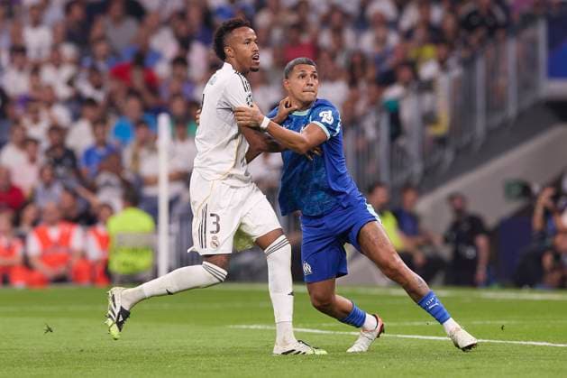 September 16, 2025, Madrid, Spain: Eder Militao (L) of Real Madrid CF and Facundo Medina (R) of Olympique de Marseille are seen in action during the UEFA Champions League 2025 2026 first round day 1 football match between Real Madrid CF and Olympique de Marseille at Santiago Bernabeu Stadium. Final score: Real Madrid CF 2 : 1 Olympique de Marseille Madrid Spain - ZUMAs197 20250916_aaa_s197_448 Copyright: xFedericoxTitonex