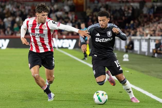16th September 2025; Gtech Community Stadium, Brentford, London, England; Carabao Cup Football, Brentford versus Aston Villa; Aaron Hickey of Brentford struggles to contain the run from Jadon Sancho of Aston Villa  IanxStephen