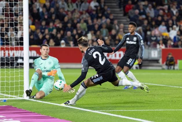 16th September 2025; Gtech Community Stadium, Brentford, London, England; Carabao Cup Football, Brentford versus Aston Villa; H& xe1;kon Rafn Valdimarsson of Brentford blocks a close range shot at his post from Matty Cash of Aston Villa  IanxStephen