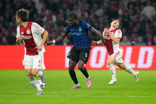AMSTERDAM, 23-08-2025, Johan Cruijff ArenA ,season 2025 2026 , UEFA Champions League football , league phase, .Match between Ajax and Inter Milan , Picture shows Inter player Marcus Thuram, Ajax player Oliver Edvardsen Ajax - Inter  x31066335x Copyright: