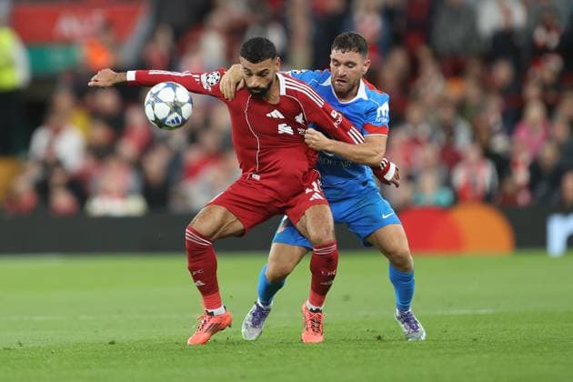 Javi Galan of Atletico Madrid and Mohamed Salah of Liverpool Liverpool v Atletico Madrid, UEFA Champions League, Group Stage, Football, Anfield, Liverpool, UK - 17 Sep 2025Liverpool Anfield United Kingdom EDITORIAL USE ONLY No use with unauthorised audio, video, data, fixture lists, club league logos or live services. Online in-match use limited to 120 images, no video emulation. No use in betting, games or single club league player publications. Copyright: xPhilxOldham Shutterstockx 15481355ai