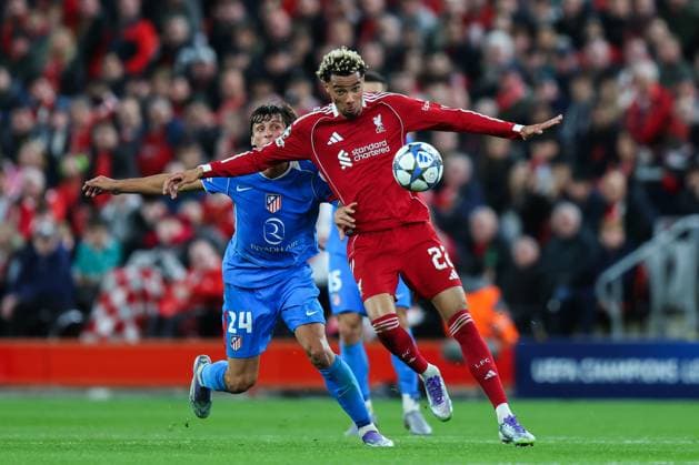 Liverpool, England, 17th September 2025. Hugo Ekitike of Liverpool controls the ball under pressure from Robin Le Normand of Atletico Madrid during the Liverpool vs Atletico Madrid UEFA Champions League match at Anfield, Liverpool. Picture credit should read: James Baylis Sportimage EDITORIAL USE ONLY. No use with unauthorised audio, video, data, fixture lists, club league logos or live services. Online in-match use limited to 120 images, no video emulation. No use in betting, games or single club league player publications. SPI_070_JB_LIV_ATM SPI-4140-0070