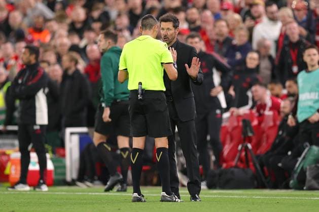Football - UEFA Champions League - League Phase - Liverpool v Atletico Madrid 17th September 2025 - UEFA Champions League - League Phase - Liverpool v Atletico Madrid - Referee Maurizio Mariani and Atletico Madrid coach Diego Simeone argue - Photo: Simon Stacpoole Offside. Liverpool UK Copyright: xSimonxStacpoolexOffside