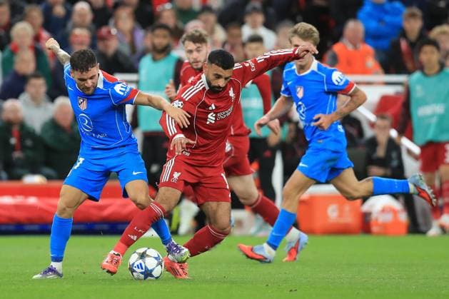 17th September 2025; Anfield, Liverpool, Merseyside, England; UEFA Champions League Football, Liverpool versus Atletico Madrid; Javi Galan of Atletico Madrid and Mohammed Salah of Liverpool compete for the ball  DavidxBlunsden
