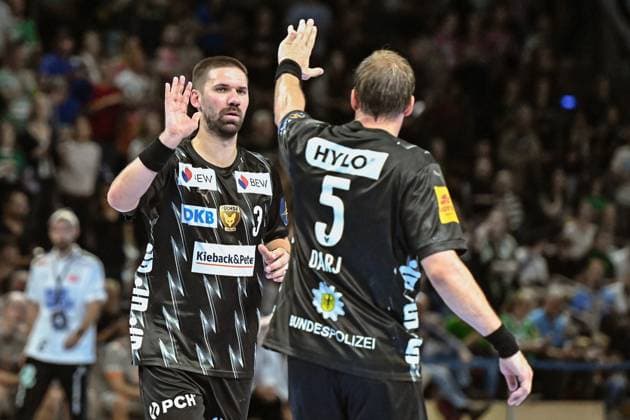 18.09.2025, xlakx, Handball, EHF Champions League, Fuechse Berlin - Aalborg Handbold v.l. Fabian Wiede (Fuechse Berlin), Max Darj (Fuechse Berlin) Jubel, Torjubel, jubelt ueber das Tor, celebrate the goal, celebration Berlin