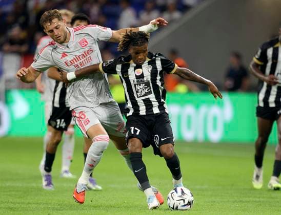 Olympique Lyonnais v Angers SCO - Ligue 1 McDonald s Tanner Tessmann of Olympique Lyonnais and Justin Kalumba of Angers SCO challenge during the Ligue 1 McDonald s match between Olympique Lyonnais and Angers SCO at Groupama Stadium on September 19, 2025 in Lyon, France. Lyon Groupama Stadium France France Copyright: xNealxSimpson Sportsphoto APLx 14135308