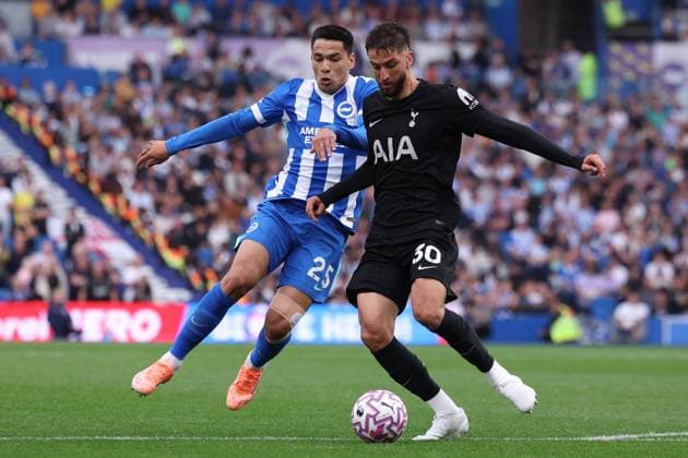 Brighton and Hove, England, 20th September 2025. Diego Gomez of Brighton and Hove Albion and Rodrigo Bentancur of Tottenham Hotspur challenge for the ball during the Brighton and Hove Albion vs Tottenham Hotspur Premier League match at the AMEX Stadium, Brighton and Hove. Picture credit should read: Paul Terry Sportimage EDITORIAL USE ONLY. No use with unauthorised audio, video, data, fixture lists, club league logos or live services. Online in-match use limited to 120 images, no video emulation. No use in betting, games or single club league player publications. SPI_048_PT_Brighton_Tottenham SPI-4150-0048