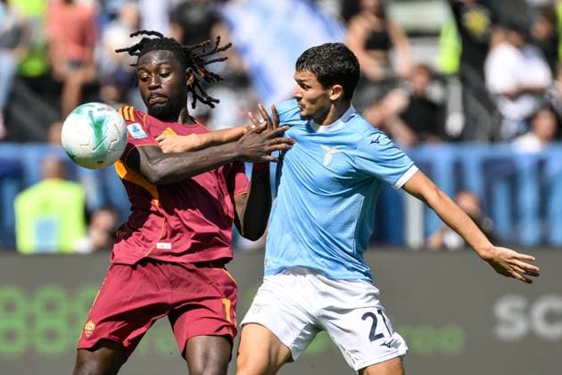 Manu Kone of AS Roma and Reda Belahyane of SS Lazio compete for the ball during the Serie A 2025 2026 football match between SS Laziio and AS Roma at Stadio Olimpico in Roma (Italy), September 21, 2025. andreaxstaccioli