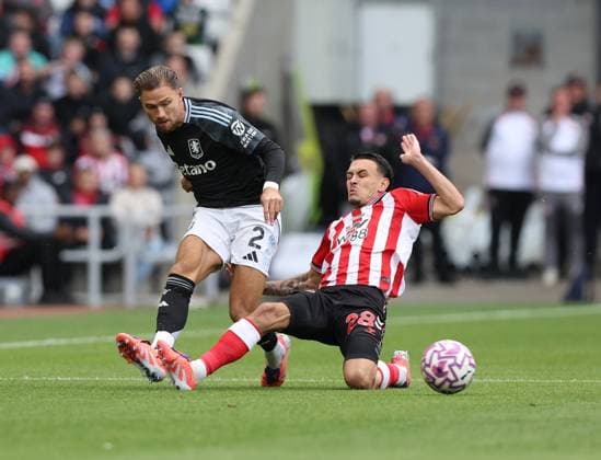 Sunderland, England, 21st September 2025. Enzo Le Fee (R) of Sunderland in action with Matty Cash of Aston Villa during the Sunderland vs Aston Villa Premier League match at the Stadium Of Light, Sunderland. Picture credit should read: Nigel Roddis Sportimage EDITORIAL USE ONLY. No use with unauthorised audio, video, data, fixture lists, club league logos or live services. Online in-match use limited to 120 images, no video emulation. No use in betting, games or single club league player publications. SPI_008_NR_NEWC_ASTO SPI-4153-0008