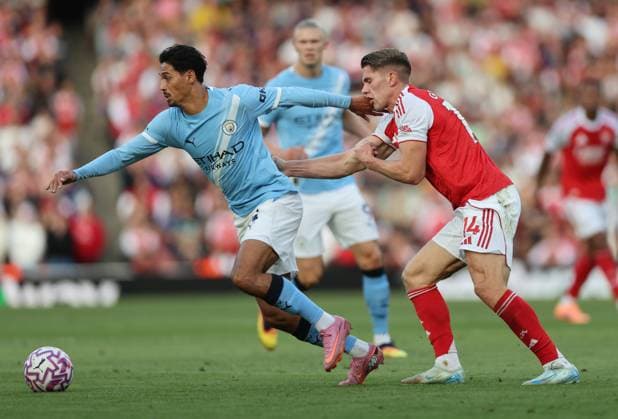 London, England, 21st September 2025. Tijjani Reijnders of Manchester City catches Viktor Gyokeres of Arsenal with his hand during the Arsenal vs Manchester City Premier League match at the Emirates Stadium, London. Picture credit should read: David Klein Sportimage EDITORIAL USE ONLY. No use with unauthorised audio, video, data, fixture lists, club league logos or live services. Online in-match use limited to 120 images, no video emulation. No use in betting, games or single club league player publications. SPI_030_DK_Arsenal_Man_City SPI-4152-0033