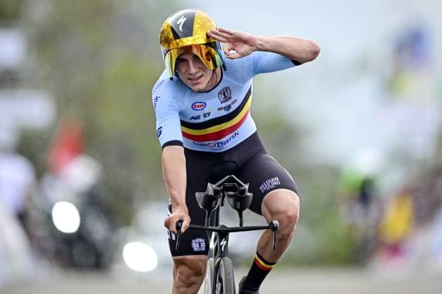 Belgian Remco Evenepoel celebrates and shows the number of his victories, three, at the arrival of the Men Elite Individual Time Trial race (40,8km) at the cycling road world championships, in Kigali, Rwanda, Sunday 21 September 2025. The 2025 UCI Road World Championships take place from 21 to 28 September in Kigali, Rwanda. DIRKxWAEM  x134929306x