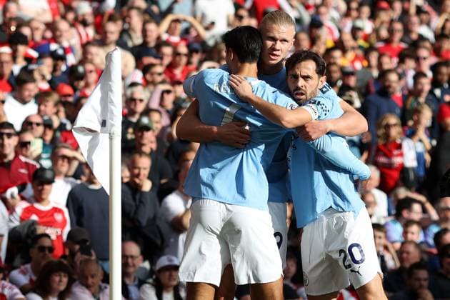 Arsenal v Man City 21 September 2025, London - Premier League Football - Arsenal v Manchester City - Erling Haaland of Manchester City celebrates scoring the opening goal with Tijjani Reijnders and Bernardo Silva - Photo: Charlotte Wilson Offside. London UK Copyright: xCharlottexWilsonx xOffsidexOffside
