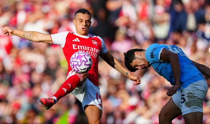 Leandro Trossard of Arsenal and Abdukodir Khusanov of Manchester City Arsenal v Manchester City, Premier League, Football, Emirates Stadium, London, UK - 21 Sep 2025London Emirates Stadium United Kingdom EDITORIAL USE ONLY No use with unauthorised audio, video, data, fixture lists, club league logos or live services. Online in-match use limited to 120 images, no video emulation. No use in betting, games or single club league player publications.  Copyright: xJavierxGarcia Shutterstockx 15487130gj