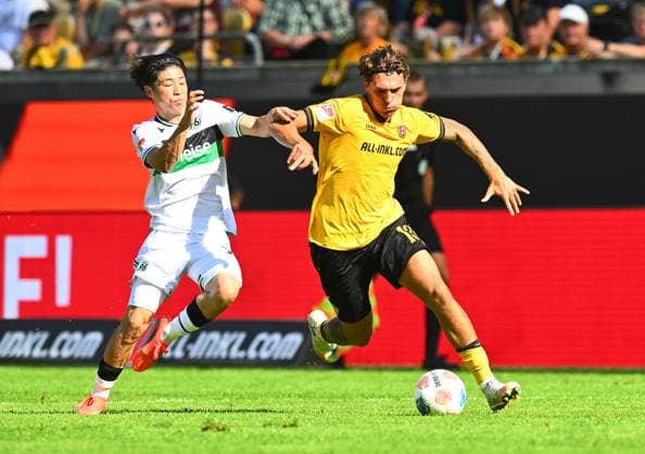 v.l.: Daisuke Yokota (Hannover), Julian Pauli (Dresden), 21.09.2025, Fussball, GER, Saison 2025 2026, 2. Bundesliga, Zweite Liga, 6. Spieltag, Rudolf-Harbig-Stadion Dresden, SG Dynamo Dresden - Hannover 96, DFB AND DFL REGULATIONS PROHIBIT ANY USE OF PHOTOGRAPHS as IMAGE SEQUENCES and or QUASI-VIDEO,