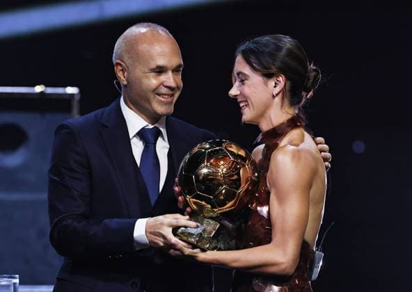 (250923) -- PARIS, Sept. 23, 2025 -- Former Spanish football player Andres Iniesta (L) congratulates Barcelona s Spanish midfielder Aitana Bonmati after she received the Woman Ballon d Or award during the 2025 Ballon d Or France Football award ceremony at the Theatre du Chatelet in Paris, France, on Sept. 22, 2025. ) (SP)FRANCE-PARIS-FOOTBALL-BALLON D OR CEREMONY GaoxJing 