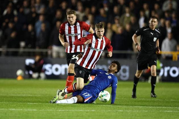 Lincoln City v Chelsea EFL Cup 23 09 2025. Chelsea midfielder Andrey Santos (17) fouls Lincoln City defender Ryley Towler (6) during the EFL Cup match between Lincoln City and Chelsea at Sincil Bank, Lincoln, United Kingdom on 23 September 2025. Lincoln Sincil Bank Lincs United Kingdom Editorial use only DataCo restrictions apply See www.football-dataco.com , Copyright: xJohnxMallettx PSI-22888-0029