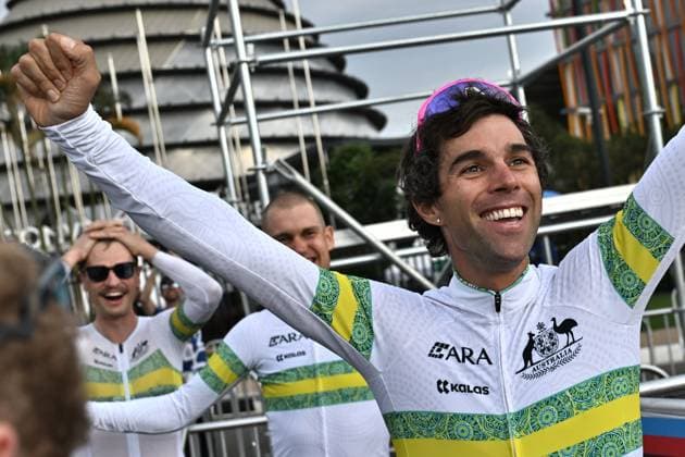 Australian Lucas Plapp and Australian Michael Matthews celebrate after winning the Team Time Trial Mixed Relay race (41,8km) at the cycling road world championships, in Kigali, Rwanda, Wednesday 24 September 2025. The 2025 UCI Road World Championships take place from 21 to 28 September in Kigali, Rwanda. DIRKxWAEM  x135168466x