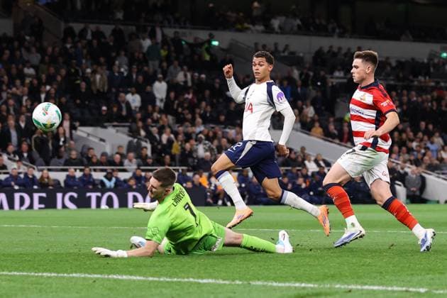 Tottenham Hotspur v Doncaster Rovers 24 September 2025, London - Carabao Cup - Third Round - Tottenham Hotspur v Doncaster Rovers - Brennan Johnson of Tottenham Hotspur scores their third goal past Doncaster Rovers goalkeeper Ian Lawlor - Photo: Jacques Feeney Offside. London UK Copyright: xJacquesxFeeneyx xOffsidexOffside