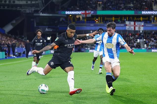 Savinho of Manchester City and Sean Roughan of Huddersfield Town Huddersfield Town v Manchester City, EFL Carabao Cup, Third Round, Football, Accu Stadium, Huddersfield, UK - 24 Sep 2025Huddersfield Accu Stadium United Kingdom EDITORIAL USE ONLY No use with unauthorised audio, video, data, fixture lists, club league logos or live services. Online in-match use limited to 120 images, no video emulation. No use in betting, games or single club league player publications. Copyright: xMattxWest Shutterstockx 15498595bq