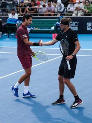 (250925) -- BEIJING, Sept. 25, 2025 -- Marcelo Melo (L) Alexander Zverev react during the men s doubles first round match between Bu Yunchaokete (China) Cameron Norrie (Britain) and Marcelo Melo (Brazil) Alexander Zverev (Germany) at 2025 China Open tennis tournament in Beijing, China, Sept. 25, 2025. (Photo by Xinhua) (SP)CHINA-BEIJING-TENNIS-CHINA OPEN-MEN S DOUBLES-FIRST ROUND (CN) MaxZihan 