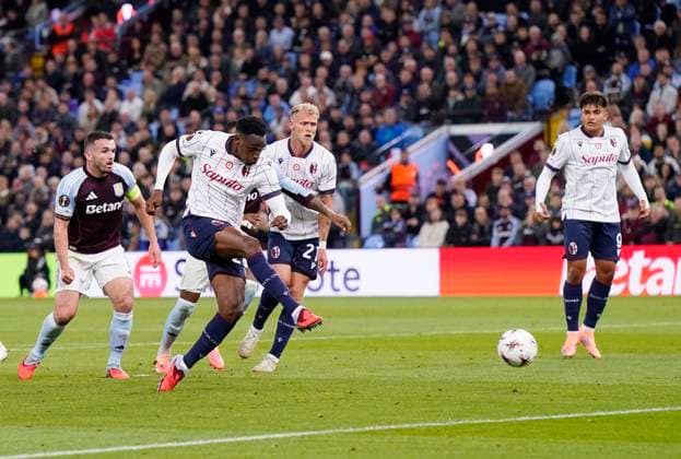 Birmingham, England, 25th September 2025. Jhon Lucumi of Bologna takes a shot on goal during the Aston Villa vs Bologna UEFA Europa League match at Villa Park, Birmingham. Picture credit should read: Andrew Yates Sportimage EDITORIAL USE ONLY. No use with unauthorised audio, video, data, fixture lists, club league logos or live services. Online in-match use limited to 120 images, no video emulation. No use in betting, games or single club league player publications. SPI_012_AY_Villa_Bologna SPI-4162-0013