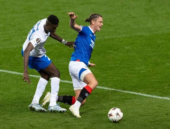 Thelo Aasgaard of Rangers in action with Ibrahima Sory Bangoura of KRC Genk during UEFA Europa League league phase match at Ibrox Stadium, Glasgow. Rangers v KRC Genk - UEFA Europa League - Ibrox Stadium, Glasgow, Lanarkshire, Scotland, UK - 25 Sep 2025Glasgow Ibrox Stadium Lanarkshire, Scotland United Kingdom EDITORIAL USE ONLY  Copyright: xRangersxFC Shutterstockx 15504638al