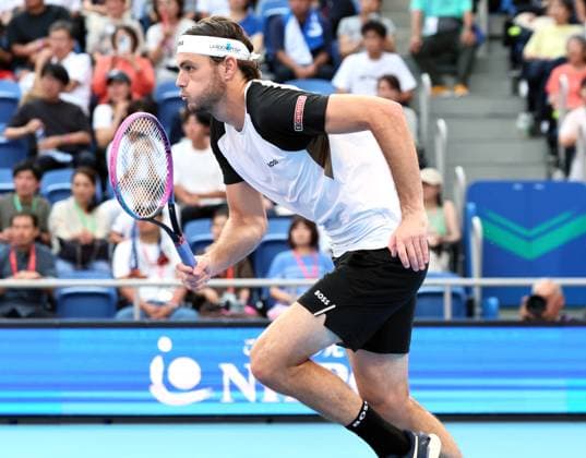 September 25, 2025, Tokyo, Japan - Taylor Fritz of the United States dashes to return the ball against Nuno Borges of Portugal during a second round match of the Japan Open Tennis tournament in Tokyo on Friday, September 26, 2025. Fritz defeated Borges 7-5, 7-6. (photo by Yoshio Tsunoda AFLO) Noxthirdxpartyxsales  aflo_304826836
