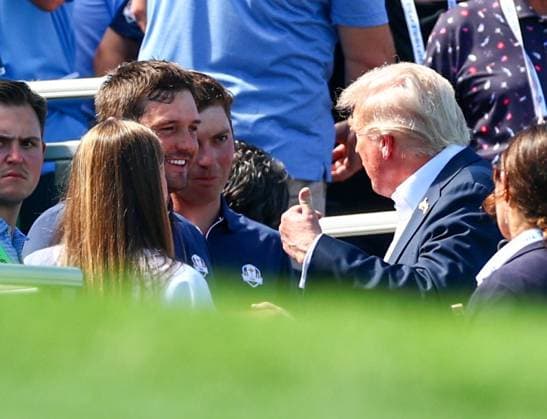 President Donald Trump chats with Bryson DeChambeau of Team USA 2025 Ryder Cup, Day One, Afternoon Four-Balls, Golf, Bethpage Black Golf Course, New York, USA - 26 Sep 2025New York Bethpage Black Golf Course New York (NY) United States of America EDITORIAL USE ONLY No use with unauthorised audio, video, data, fixture lists, club league logos or live services. Online in-match use limited to 120 images, no video emulation. No use in betting, games or single club league player publications. Copyright: xJamesxMarsh Shutterstockx 15500200au