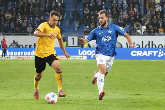 26.09.2025, xpfrx, Fussball 2.Bundesliga, SV Darmstadt 98 - Dynamo Dresden v.l. Konrad Faber (SG Dynamo Dresden) Kilian Julian Corredor (SV Darmstadt 98) Zweikampf, Aktion, action, battle for the ball (DFL DFB REGULATIONS PROHIBIT ANY USE OF PHOTOGRAPHS as IMAGE SEQUENCES and or QUASI-VIDEO) Darmstadt