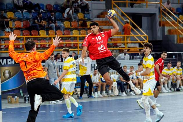 (250927) -- CAIRO, Sept. 27, 2025 -- Mohamed Emad (top) of Al Ahly SC shoots during the 18th IHF Men s Club World Championship, WM, Weltmeisterschaft 2025 preliminary round group C handball match between Al Ahly SC of Egypt and Sydney Uni HC of Australia in Cairo, Egypt, on Sept. 26, 2025. ) (SP)EGYPT-CAIRO-HANDBALL-IHF-MEN S CLUB WORLD CHAMPIONSHIP-PRELIMINARY ROUND MATCH AhmedxGomaa 