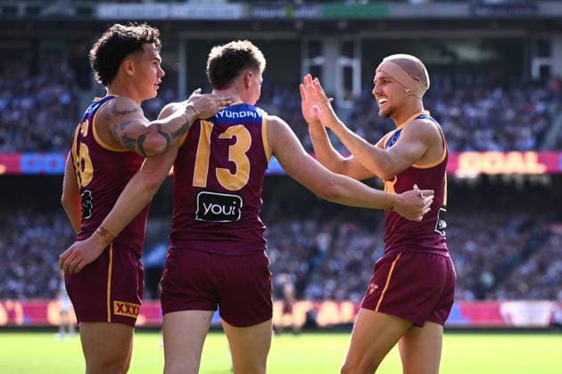 AFL GRAND FINAL, (L-R) Cam Rayner, Logan Morris and Kai Lohmann of the Lions celebrate a goal from Charlie Cameron of the Lions during the AFL Grand Final between the Geelong Cats and the Brisbane Lions at the Melbourne Cricket Ground in Melbourne, Saturday, September 27, 2025. ( NO ARCHIVING, EDITORIAL USE ONLY MELBOURNE VICTORIA AUSTRALIA  Copyright: xJOELxCARRETTx 20250927126531694625