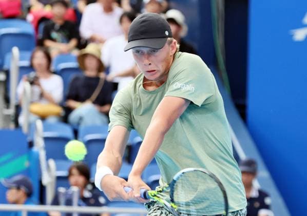 September 27, 2025, Tokyo, Japan - Ethan Quinn of the United States returns the ball against Holger Rune of Denmark during a second round match of the Japan Open Tennis tournament in Tokyo on Saturday, September 27, 2025. Rune defeated Quinn 6-4, 6-2. (photo by Yoshio Tsunoda AFLO) Noxthirdxpartyxsales  aflo_304943125