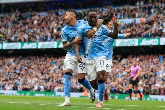 Manchester City v Burnley Premier League 27 09 2025. Jeremy Doku (11) and Savinho (26) of Manchester City celebrate the own goal by Maxime Esteve (5) of Burnley to make it 1-0 during the Premier League match between Manchester City and Burnley at the Etihad Stadium, Manchester, England on 27 September 2025. Manchester Etihad Stadium Manchester England Editorial use only DataCo restrictions apply See www.football-dataco.com , Copyright: xConorxMolloyx PSI-22920-0021