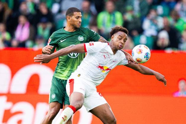 27.09.2025 - Fußball, 2025 2026, 1. Bundesliga, 5. Spieltag, VfL Wolfsburg - RB Leipzig: (L-R) Vini Souza (Wolfsburg), Assan Ouedraogo (Leipzig) DFL REGULATIONS PROHIBIT ANY USE OF PHOTOGRAPHS AS IMAGE SEQUENCES AND OR QUASI-VIDEO.