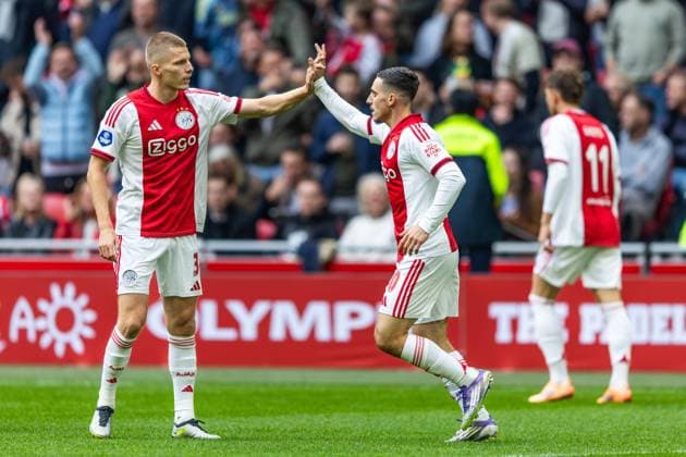 AMSTERDAM , 27-09-2025 , Johan Cruyff ArenA , season 2025 2026 , Dutch Eredivisie football . Match between Ajax and NAC Breda , Picture shows goal celebration of Ajax player Oscar Gloukh with Ajax player Anton Gaaei (1-0). Ajax - NAC  x31220778x Copyright: