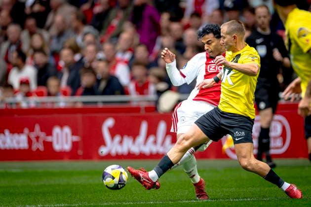 AFC Ajax Amsterdam defender Owen Wijndal, NAC Breda defender Lewis Holtby during the match AFC Ajax Amsterdam vs NAC Breda at the Johan Cruijff ArenA for the Dutch Vriendenloterij Eredivisie season 2025-2026 in AMSTERDAM, Netherlands on 27 september 2025, (photo by Marcel van Dorst EYE4images DeFodi Images) AFC Ajax Amsterdam defender Owen Wijndal, NAC Breda defender Lewis Holtby during the match AFC Ajax Amsterdam vs NAC Breda at the Johan Cruijff ArenA for the Dutch Vriendenloterij Eredivisie season 2025 2026 in AMSTERDAM, Netherlands on 27 september 2025, photo by Marcel van Dorst EYE4images DeFodi Images