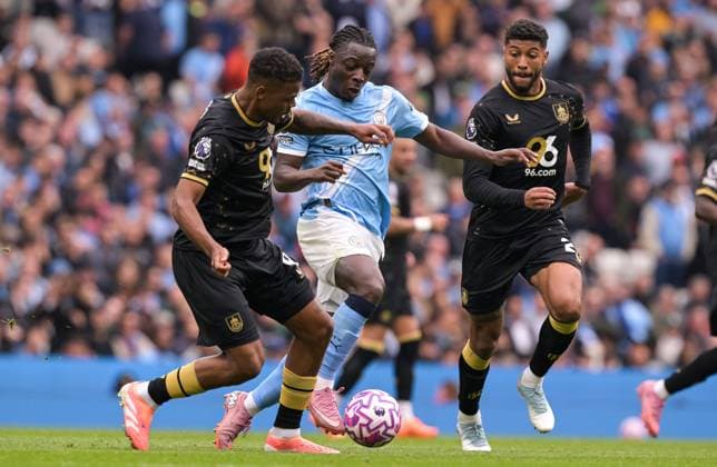 Jeremy Doku of Manchester City rescues a bad pass from Phil Foden as Josh Laurent and Lyle Foster of Burnley challenge Manchester City v Burnley, Premier League, Football, Etihad Stadium, Manchester, UK - 27 Sep 2025Manchester Etihad Stadium United Kingdom EDITORIAL USE ONLY No use with unauthorised audio, video, data, fixture lists, club league logos or live services. Online in-match use limited to 120 images, no video emulation. No use in betting, games or single club league player publications.  Copyright: xGreigxCowie Shutterstockx 15503920at