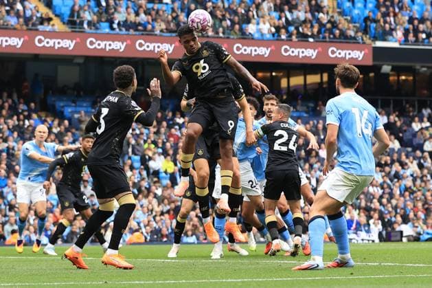 27th September 2025; Etihad Stadium, Manchester, England; Premier League Football, Manchester City versus Burnley; Lyle Foster of Burnley heads the ball clear of his box  DavidxBlunsden