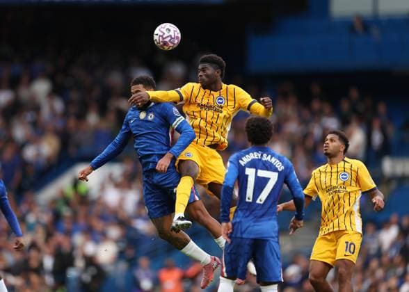 27th September 2025; Stamford Bridge, Chelsea, London, England: Premier League Football, Chelsea versus Brighton and Hove Albion; Carlos Baleba of Brighton &amp; Hove Albion heads the ball above Reece James of Chelsea  JohnxPatrickxFletcher