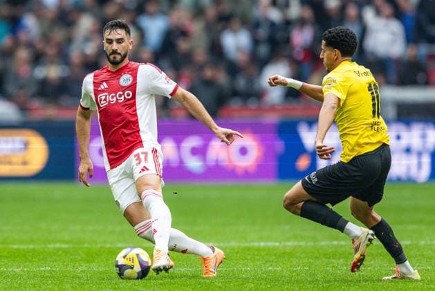 AMSTERDAM , 27-09-2025 , Johan Cruyff ArenA , season 2025 2026 , Dutch Eredivisie football . Match between Ajax and NAC Breda , Picture shows Ajax player Josip Sutalo and NAC Breda player Mohamed Nassoh. Ajax - NAC  x31222133x Copyright: